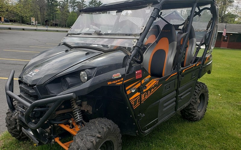 A black and orange UTV available to rent